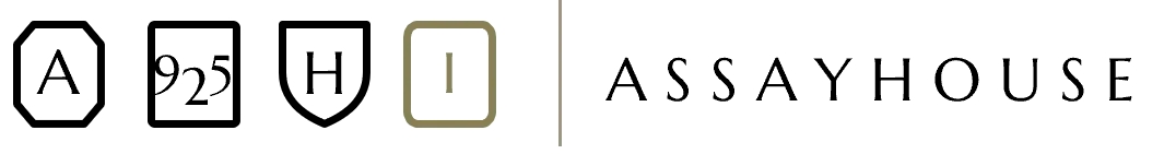 Volume One's hallmark set: the three sitewide marks — A, 925, H — alongside the volume's own Roman numeral I mark in Olive, next to the Assayhouse wordmark